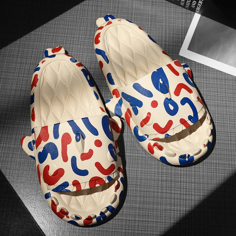 Pair of grey EVA foam open-toe slippers with a raised shark fin design on the front.