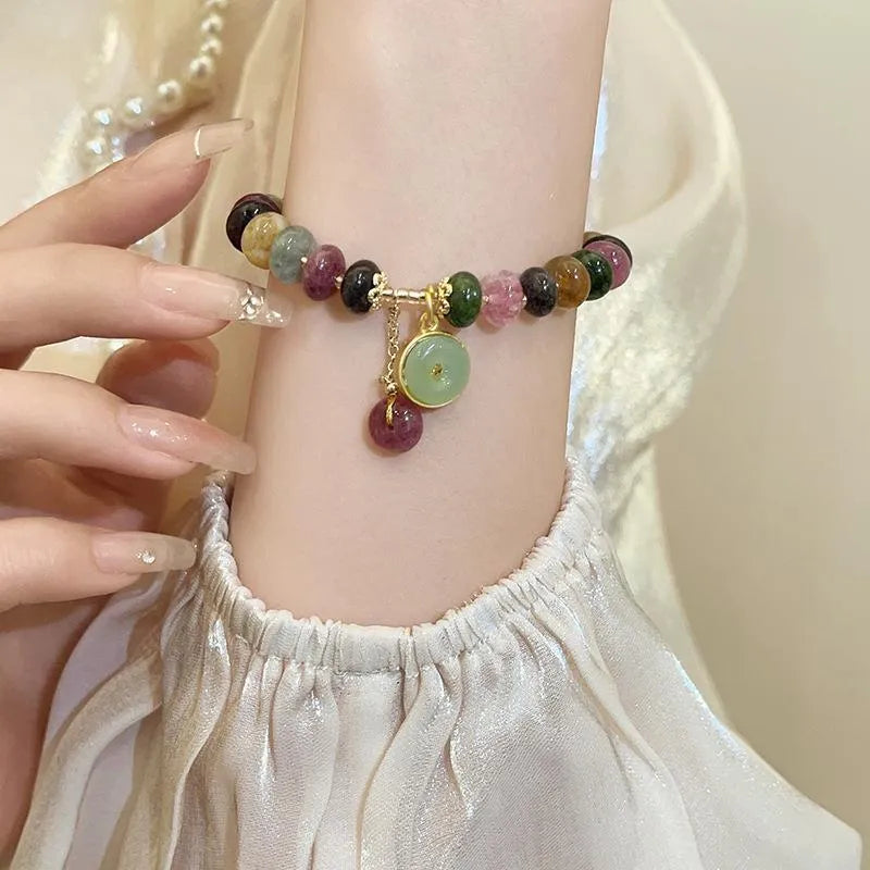 Natural stone abacus bead bracelet with a colourful tourmaline rabbit pendant.