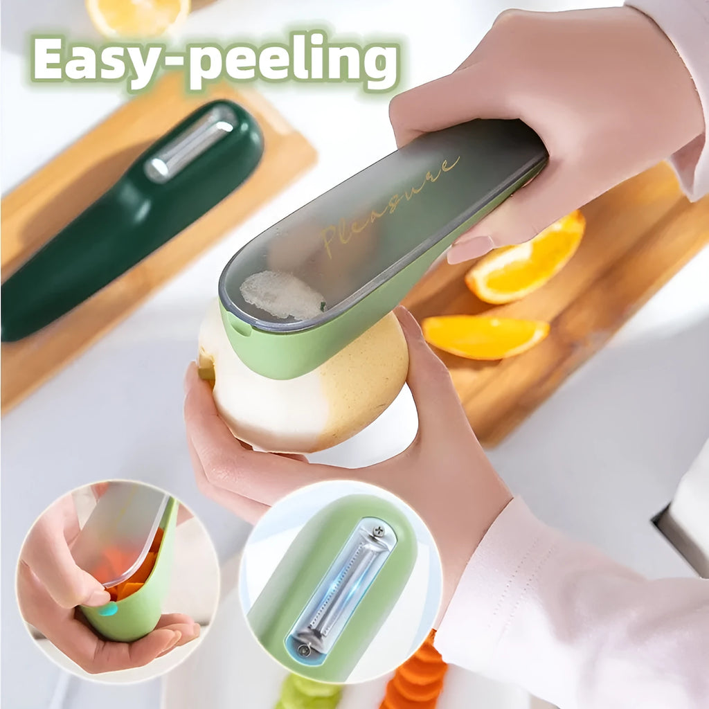 Dark green kitchen peeler with a storage tube extended, showing the stainless steel blade and a hanging hole on the handle.