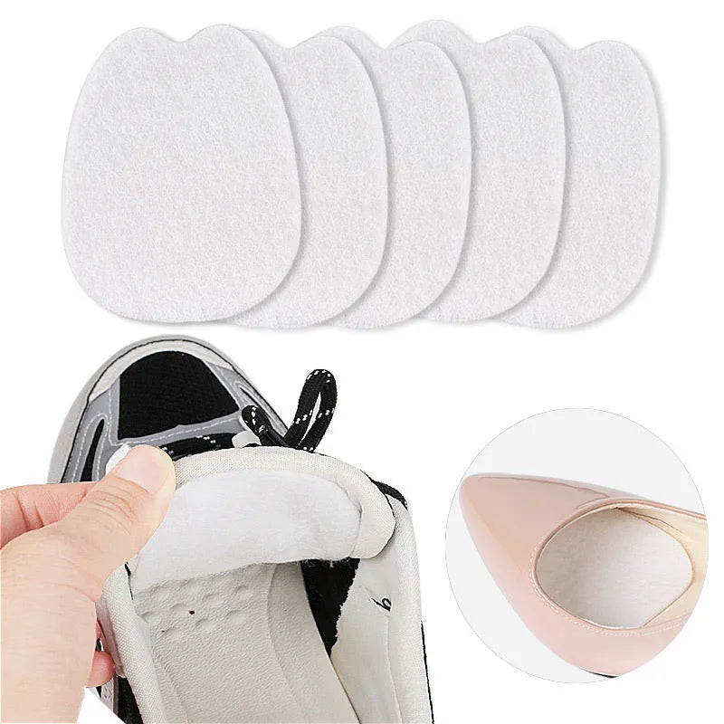White thin felt self-adhesive patch for protecting the tongue of a shoe from wear.