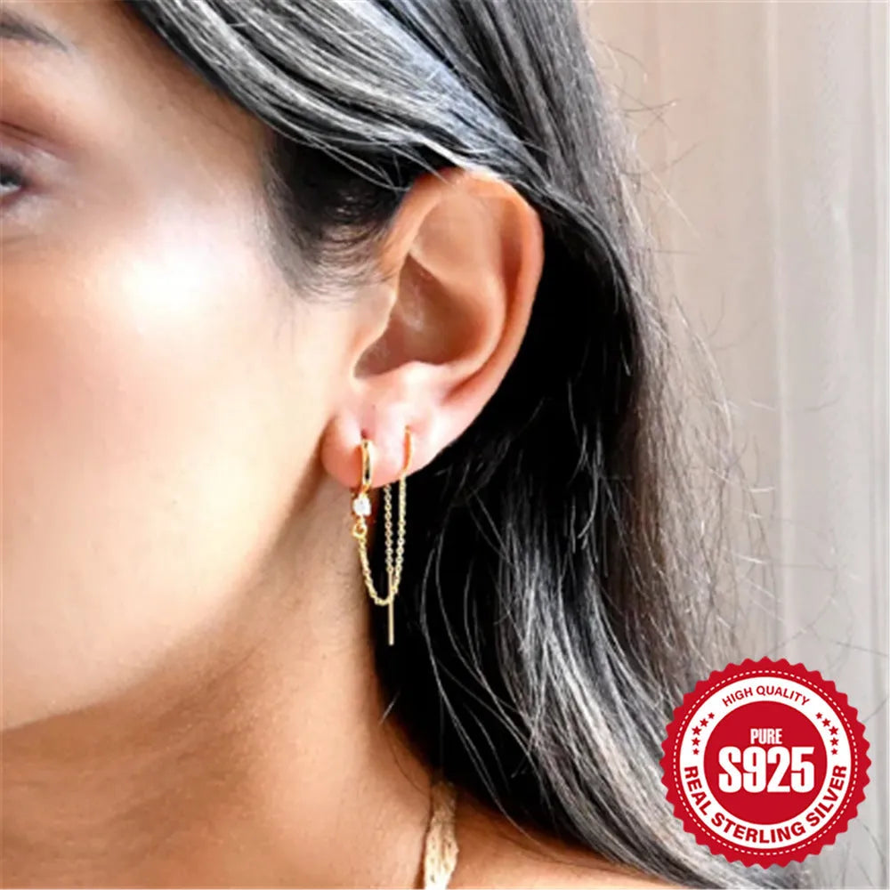 S925 sterling silver ear studs with geometric flower design and tassel chain elements in golden colour