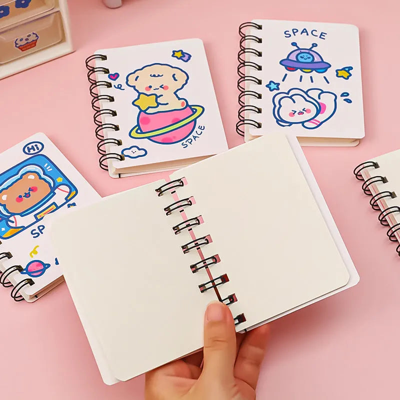 Astronaut-themed portable flipper notebook showing 10.5 by 8 cm size and colourful cover options.
