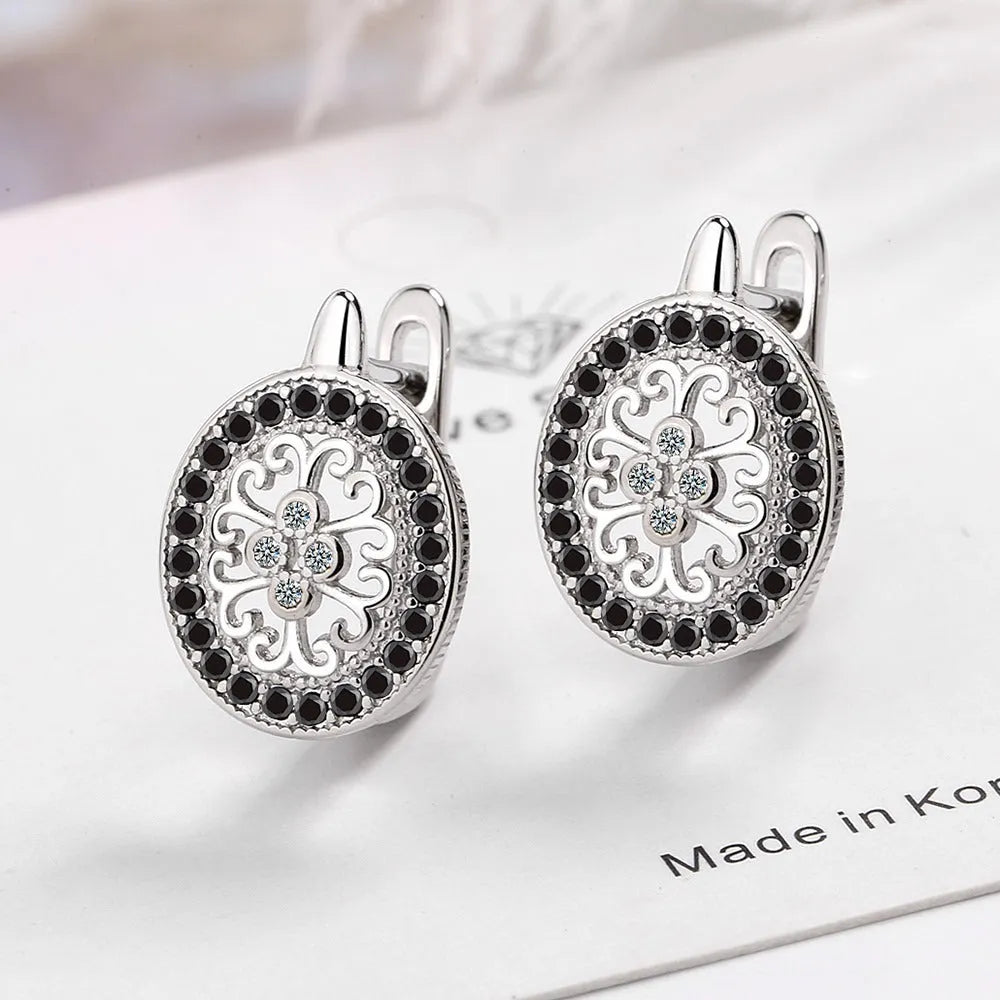 Pair of round diamond-encrusted ear clip earrings in copper white gold plated platinum colour