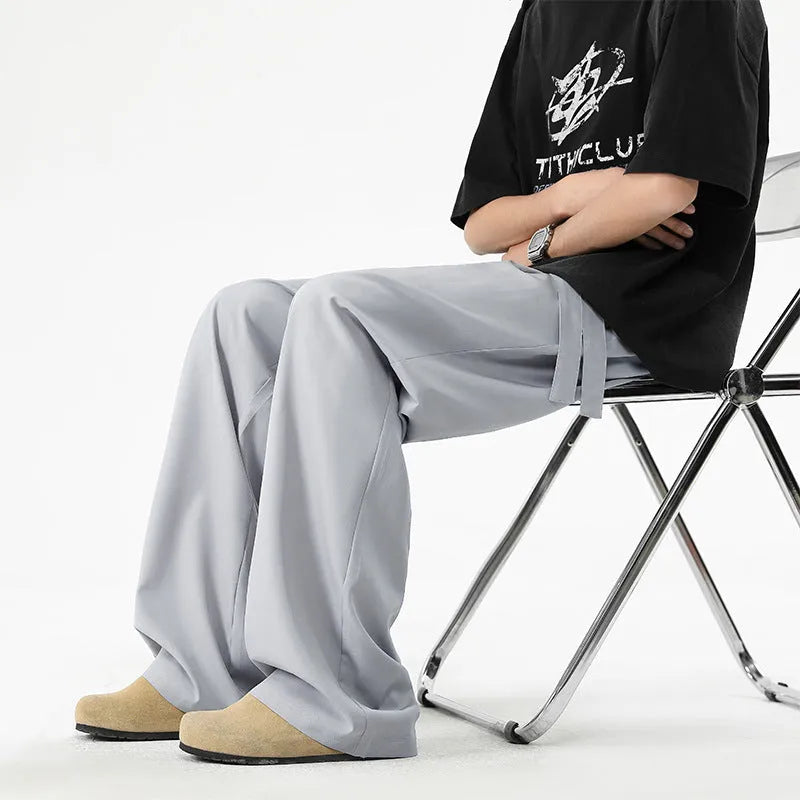 Men's quick-drying loose straight wide-leg casual pants in black polyester blend, side view