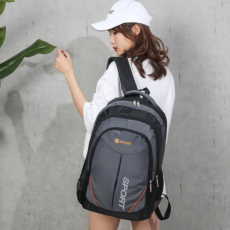 Men's nylon backpack with curved shoulder straps in black, blue, grey or red with letter detailing