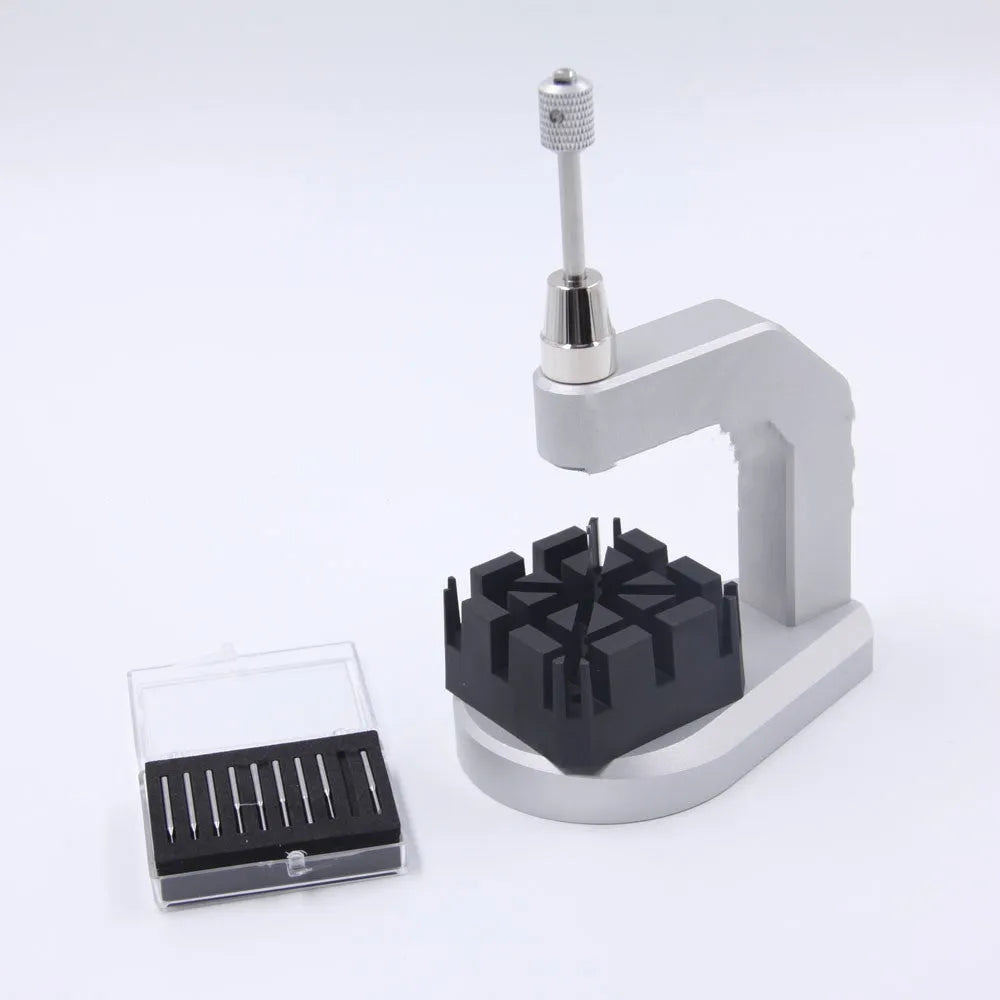 Silver-coloured tool steel press strap removal tool for watches and jewellery.