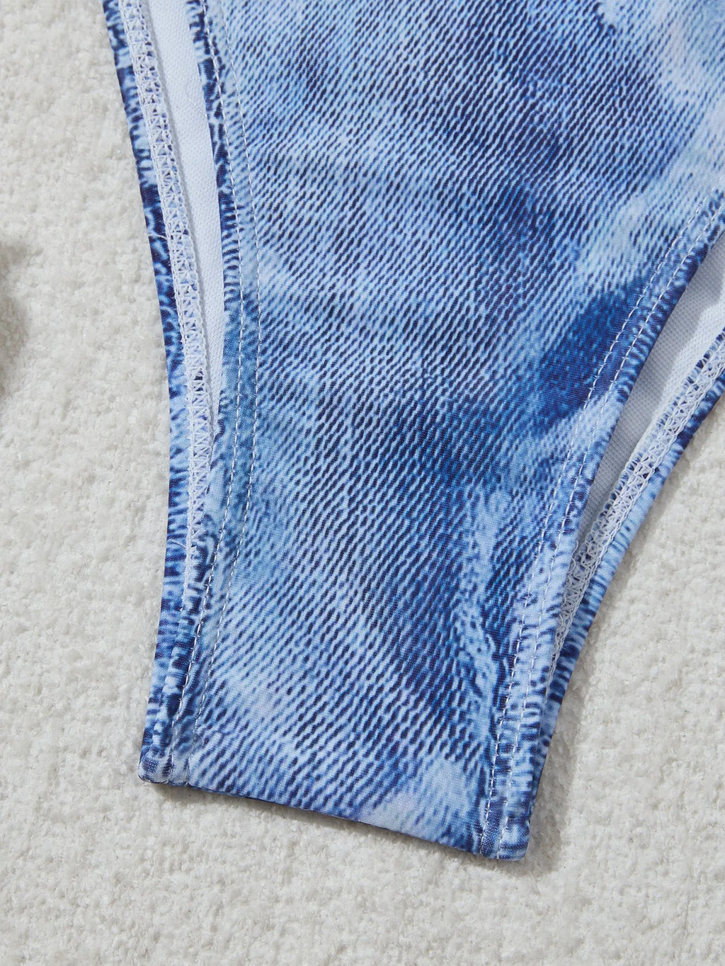 Denim blue women's bikini swimsuit with adjustable straps, shown as a complete set.