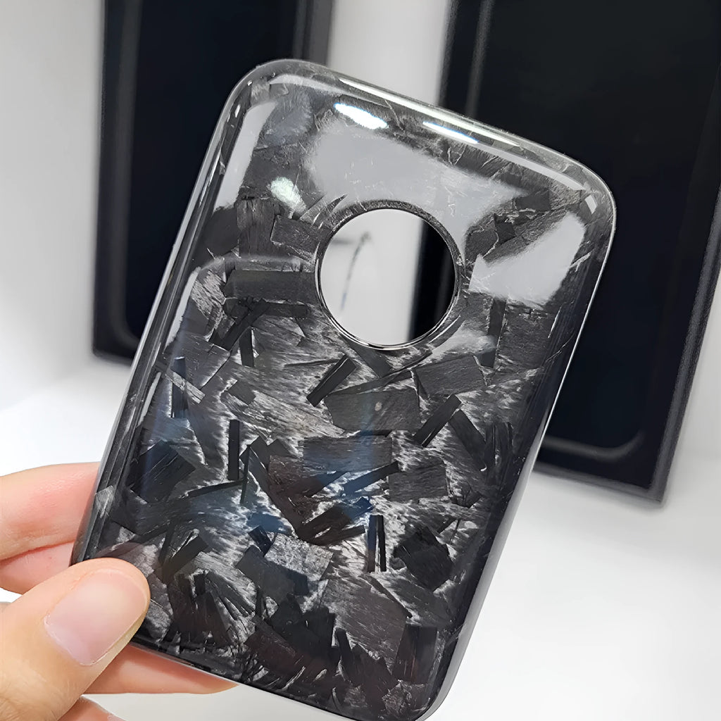 Black Kevlar hard shell case for Apple MagSafe power bank, shown in 3K round hole bright finish.