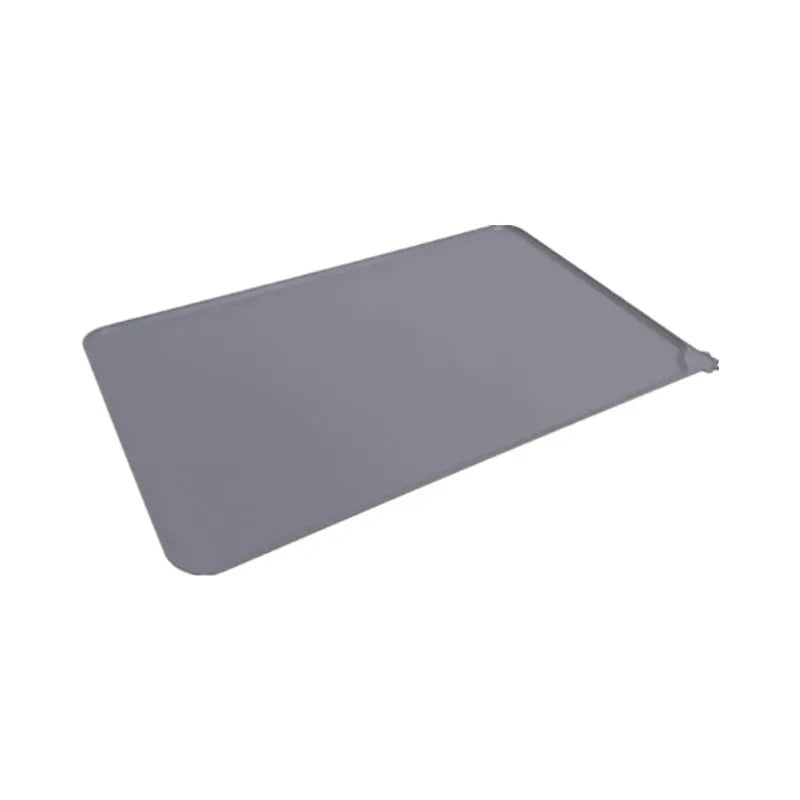 Silicone pet placemat in grey colour under a dog food bowl, showing raised edge.