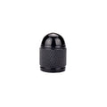 Aluminium alloy mountain bike tyre valve cap in assorted colours on a bicycle wheel.