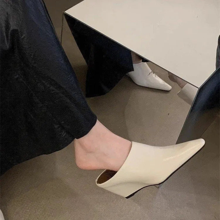 Women's Black closed toe wedge half slippers made of PU leather
