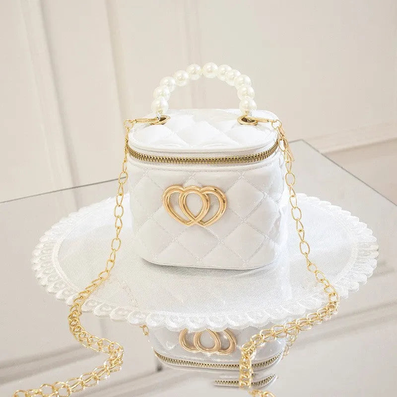 PVC bucket-shaped gel bag for women with a heart pattern, shown in apricot colour.
