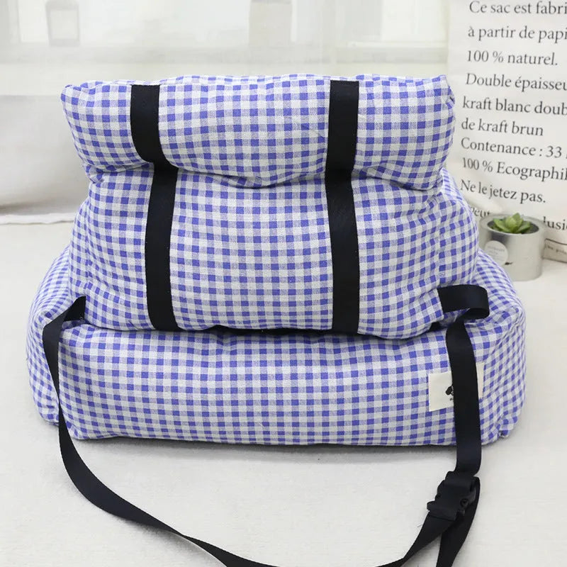 Grey and blue plaid cloth car-mounted pet nest bed for small dog travel.