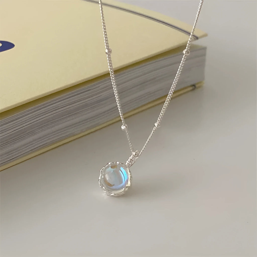 Women's 925 silver curb chain necklace with a round geometric stone pendant.