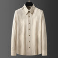Coffee-coloured men's long-sleeved slim-fit business shirt with wool lining on a hanger