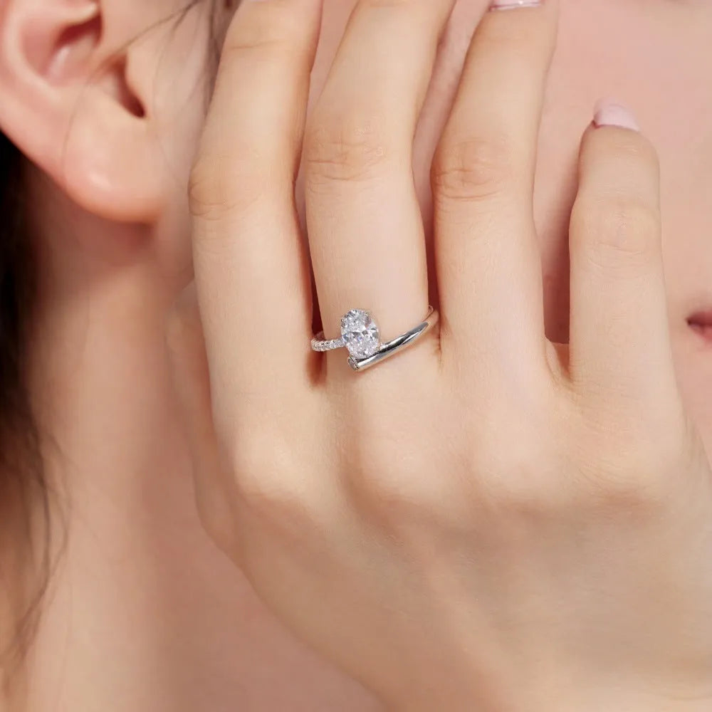S925 sterling silver ring with oval zircon star track design on white background