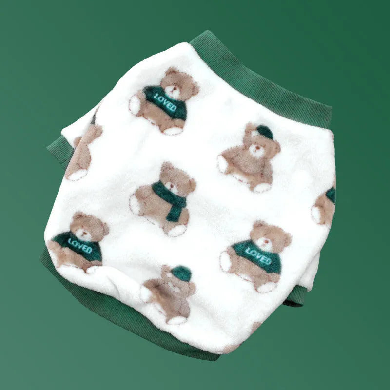 Female corgi wearing winter dog pajamas in coral fleece with plain pattern, showing bear style colour, side view