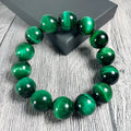 Green Tiger Eye stone bracelet with polished geometric beads in various sizes