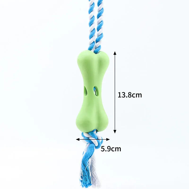 Green porous bone-shaped dog toy with rope knots for treat dispensing and dental chewing