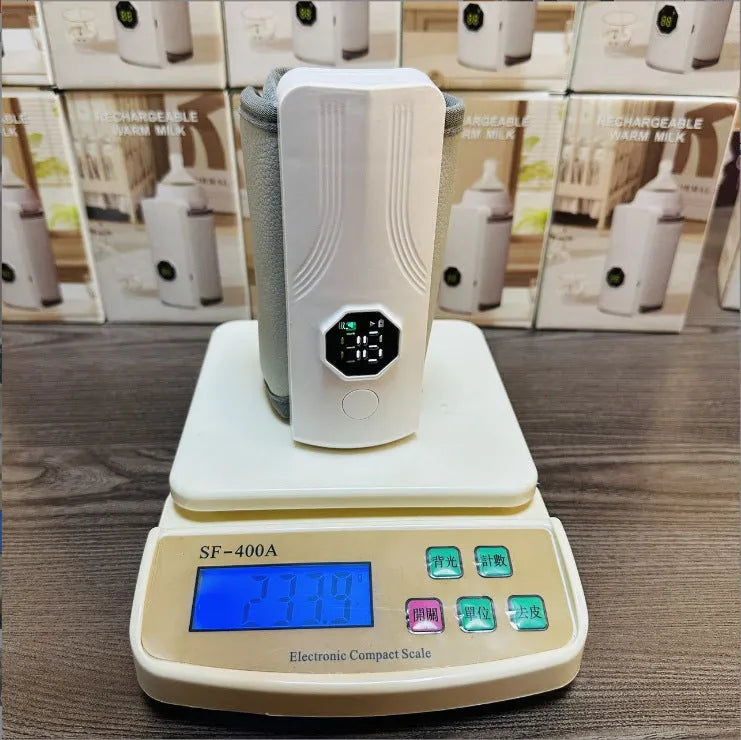Grey and white portable car charger electric milk warmer for baby bottles.