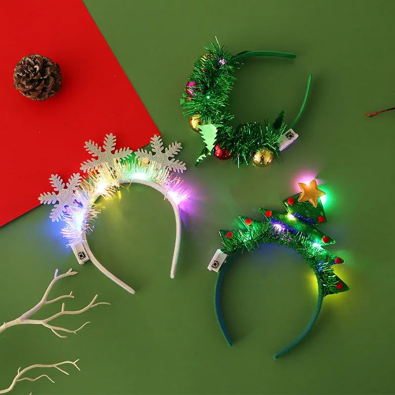 Christmas LED hair band with flashing lights, plastic headband in festive motifs including tree, snowflake, and deer horn designs