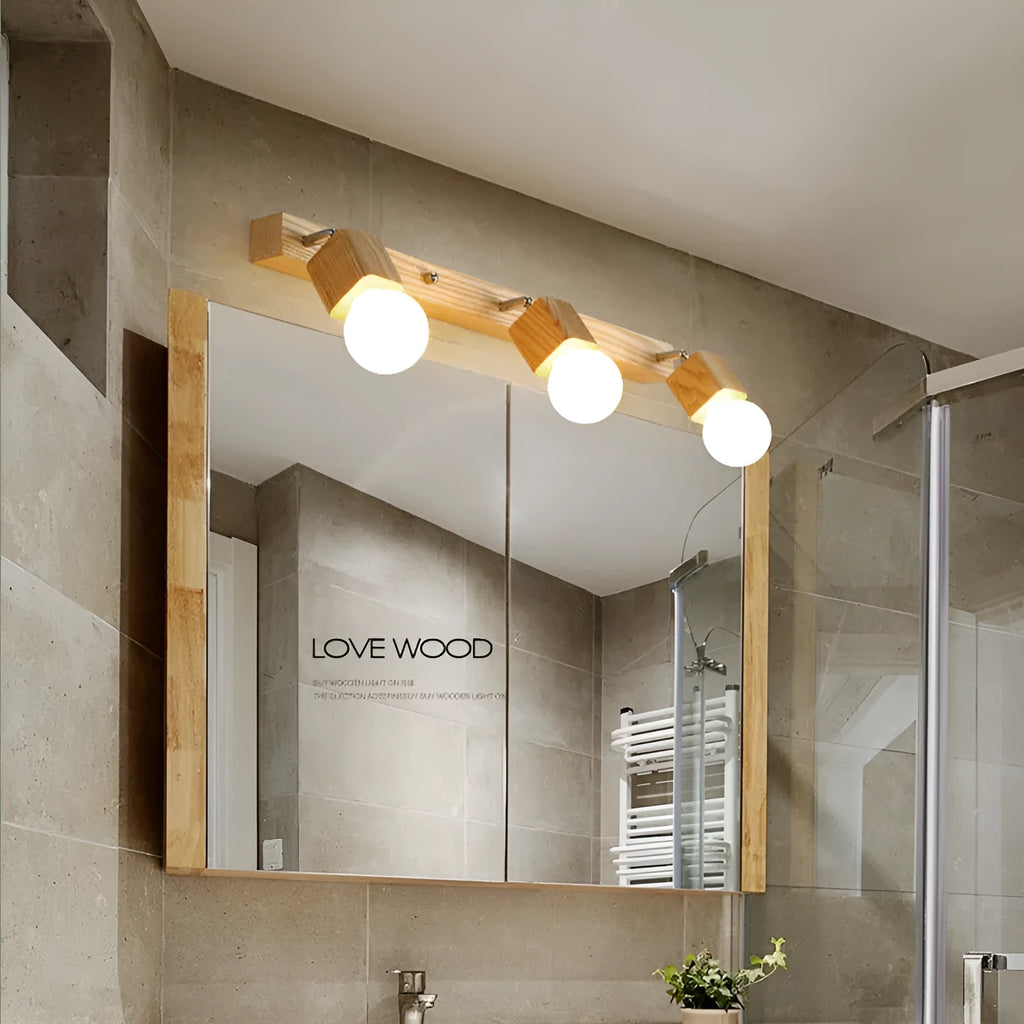 Single head mirror cabinet wall lamp with a 24cm diameter frame.