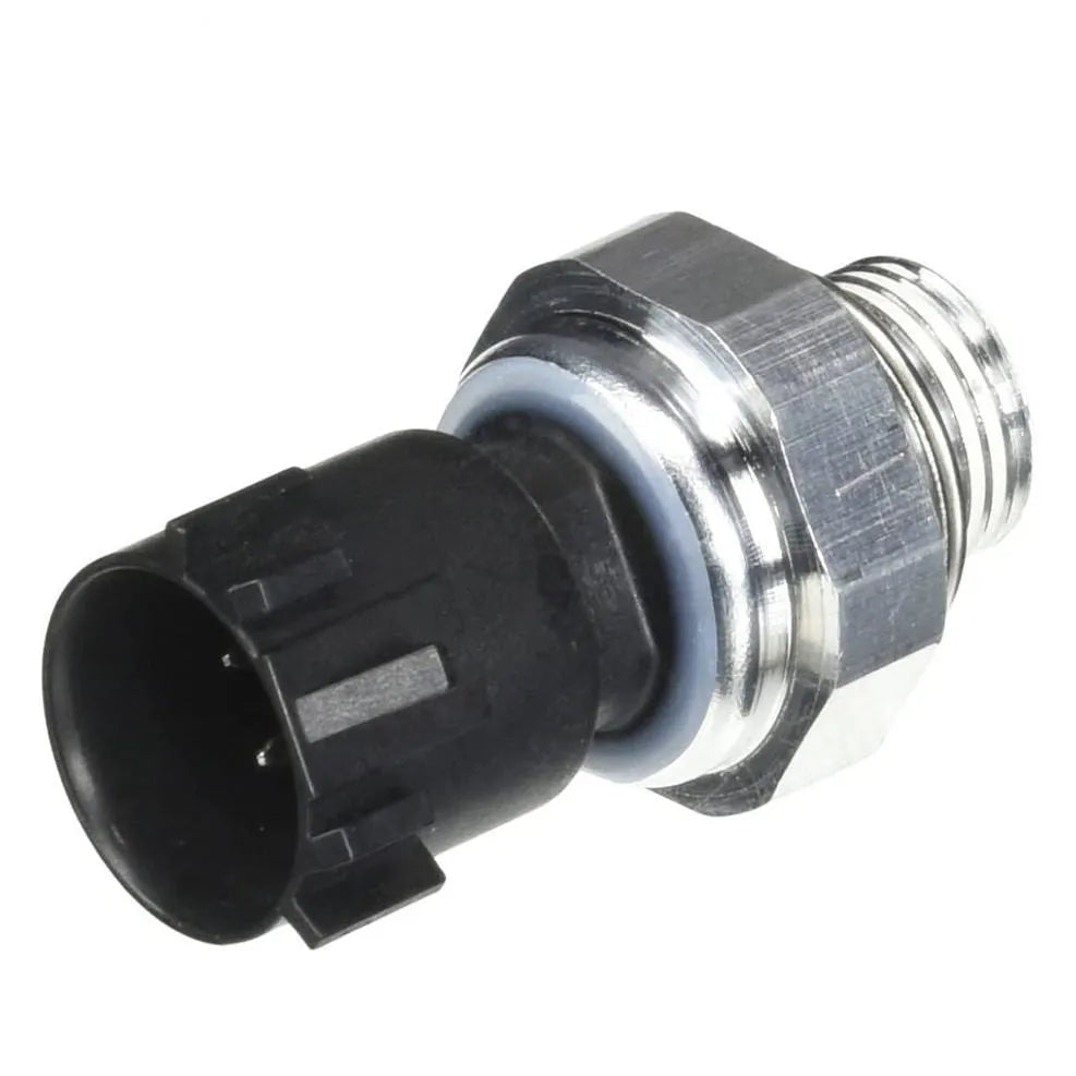 Silver automobile fuel pressure sensor on a white background.