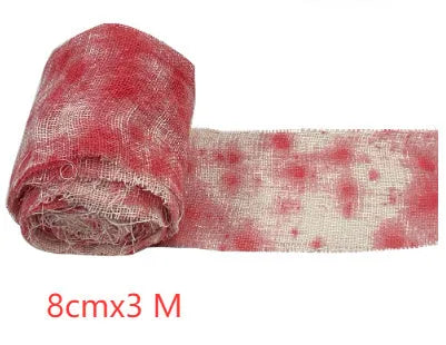 Roll of 8cm wide bloody red Halloween bandage gauze for horror decoration next to a white variant.