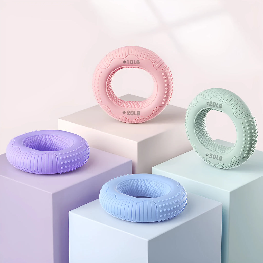 Silicone hand grip ring in five colours showing textured surface and compact 7.4cm size for finger and forearm strength training