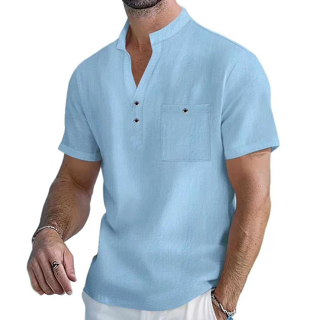 Man wearing a light apricot coloured stand collar linen blend short sleeve t-shirt with a loose fit.