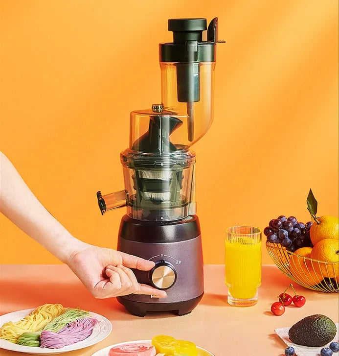 Grey slow masticating juicer with 90mm feed chute and multi-function separator on countertop