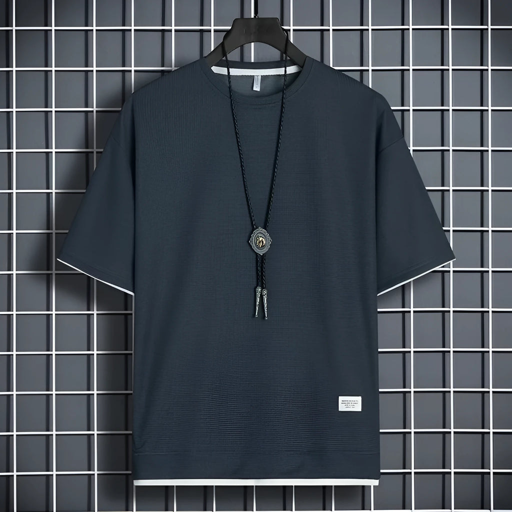 Half sleeve loose pullover top in polyester, available in seven colours and sizes M to 5XL