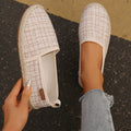 Fisherman shoes in beige with canvas upper and rope-style bottom, flat heel design