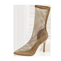 Gold high heel sandals with pointed stiletto heels and mesh upper