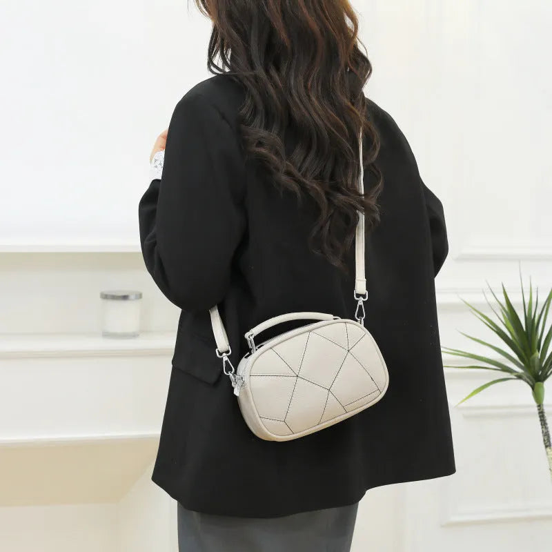 Three-layer retro patchwork small bag in round suitcase shape with stitching detail
