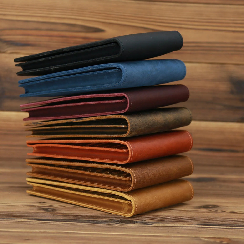 Slim brown cowhide men's wallet open to show 18 card slots and a phone compartment.