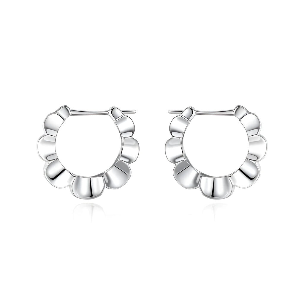 A pair of sterling silver geometric earrings with round accents on a white background.
