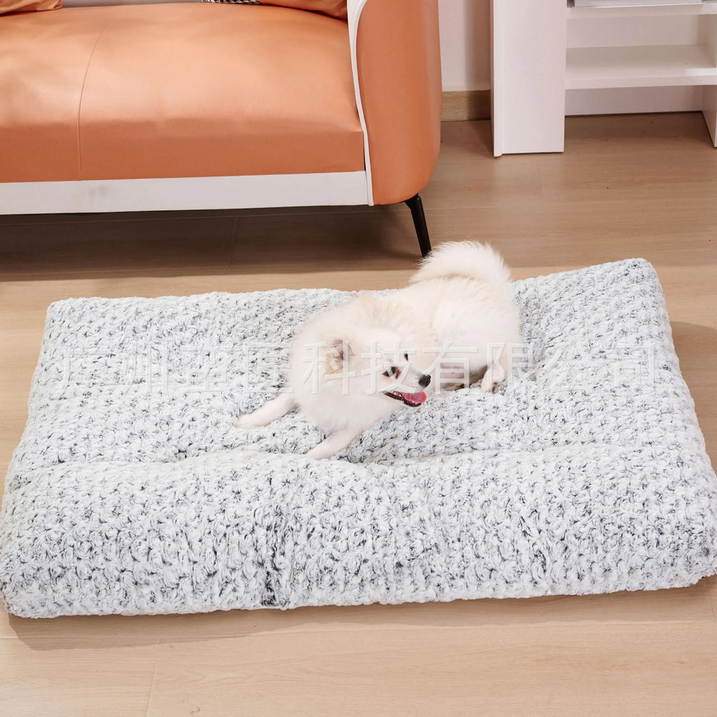Light gray embossed velvet dog bed for small to large pets on a wooden floor