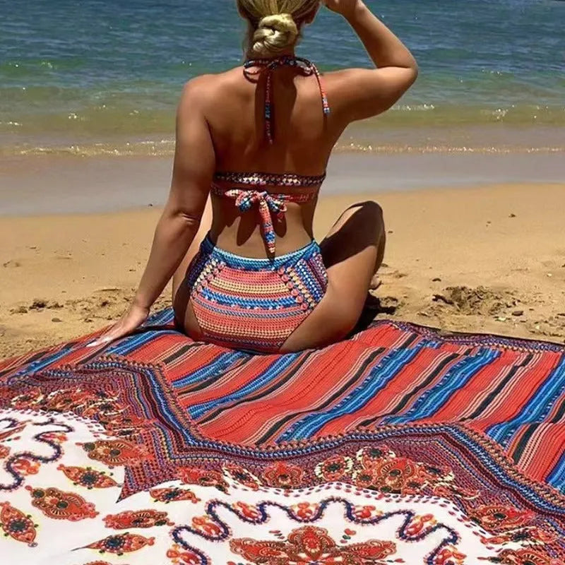 Women's three-piece split-front swimsuit set in high-waist briefs with a matching coat.