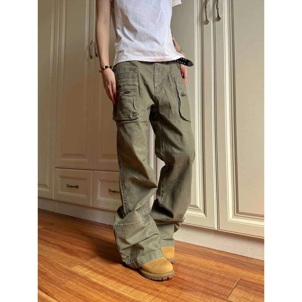 Green and black double zipper casual cotton pants with an elasticated waistband on a hanger.