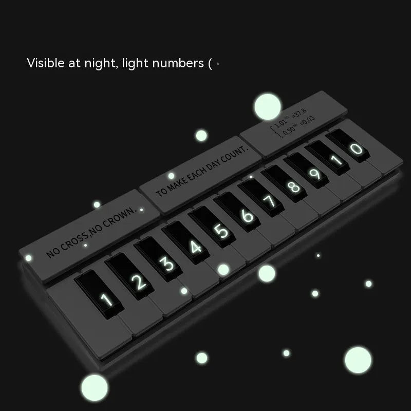 Black and white piano-shaped plastic parking sign measuring 148mm wide