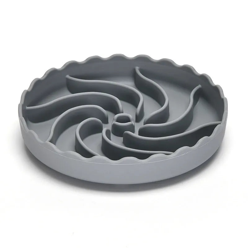 Food-grade silicone slow feeder dog bowl in blue with suction cup base and raised maze ridges