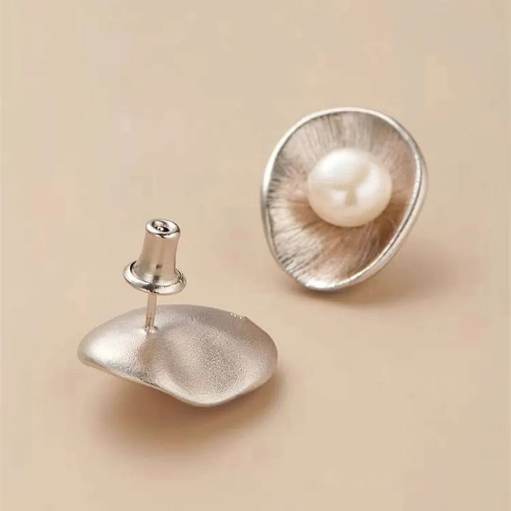 Sterling silver needle earrings with geometric design and pearl accents in gold electroplated finish