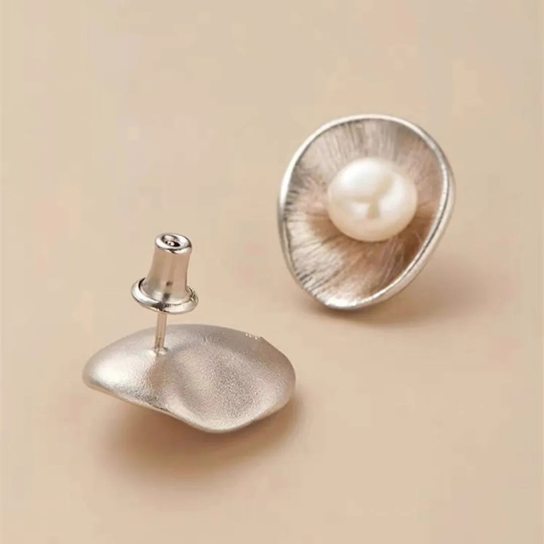Sterling silver needle earrings with geometric design and pearl accents in gold electroplated finish