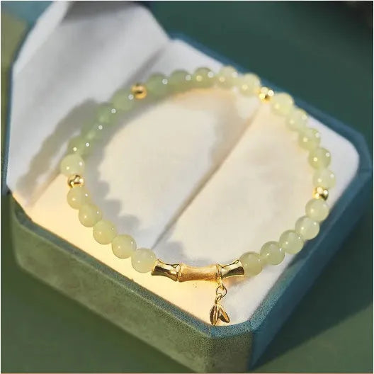 Retro bamboo design bracelet with Ruyi symbol and floral glass beads in electroplated finish