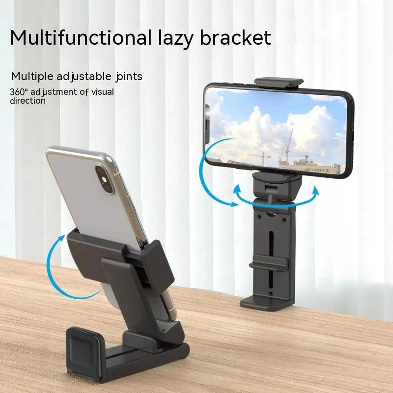 H22 Black colour 360-degree rotating collapsible mobile phone desktop holder on a wooden table.