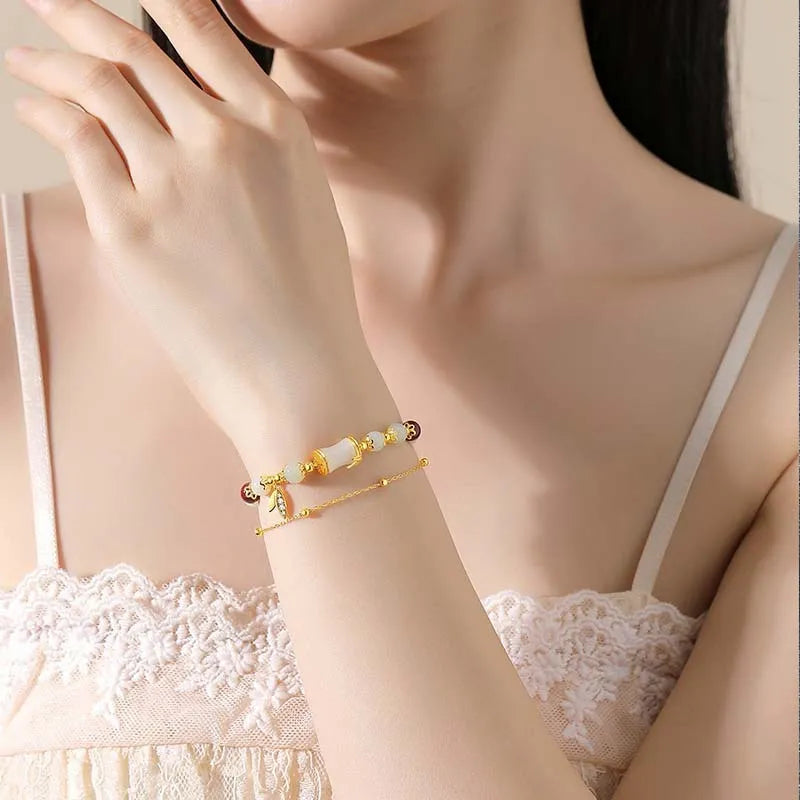 Retro bamboo design bracelet with Ruyi symbol and floral glass beads in electroplated finish