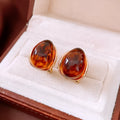 Amber water drop ear studs and ear clip in silver needle coffee colour with real gold plating