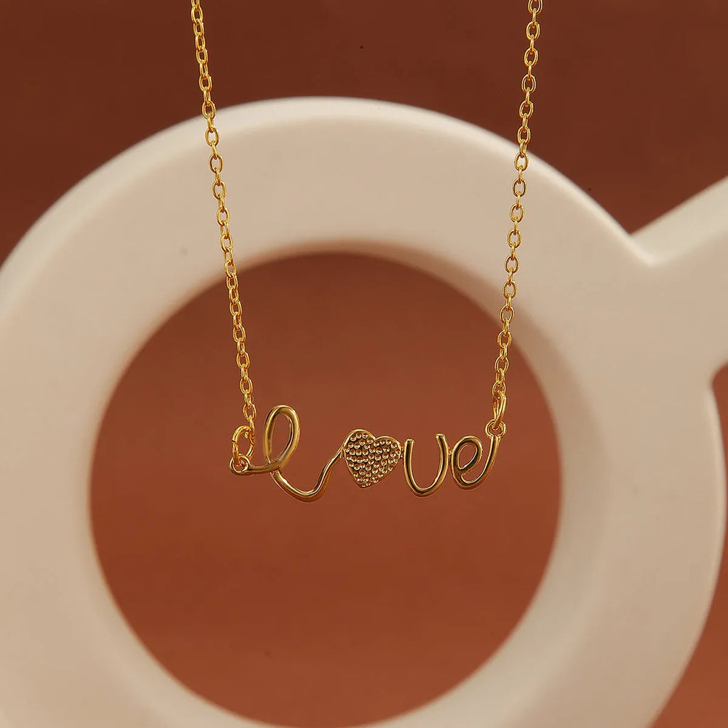 Gold plated copper infinity love pendant necklace with diamond accents and fine chain.