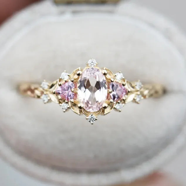 Women's alloy flower ring with inlaid zircon in gold pink diamond colour on white background